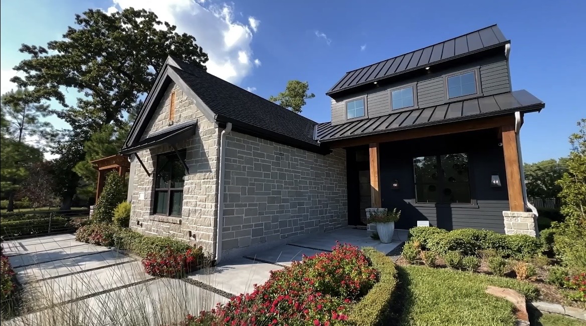 Stone and dark siding home in a Spring area neighborhood